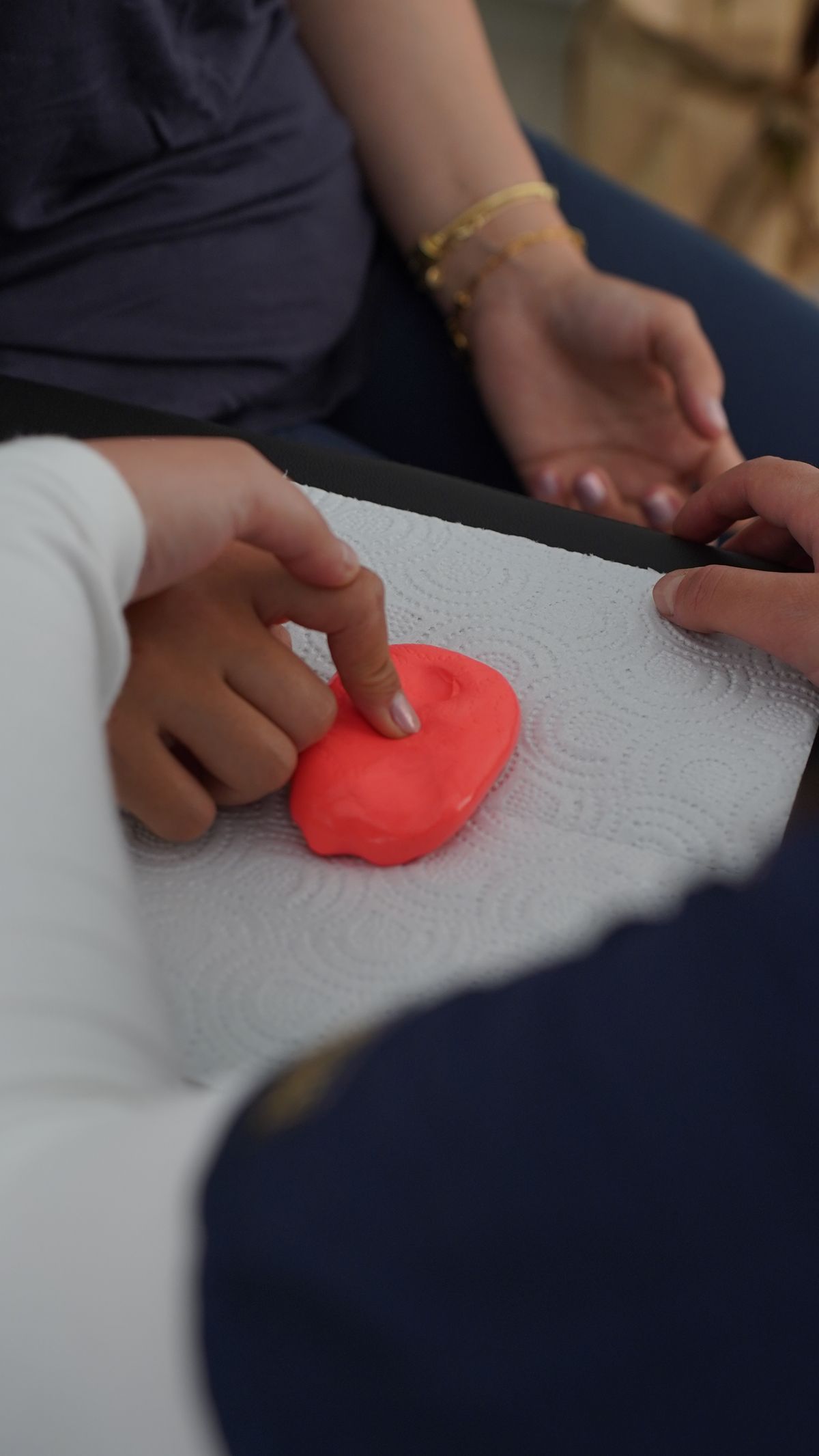 Child engaged in sensory play as positive reinforcement during an ABA therapy session