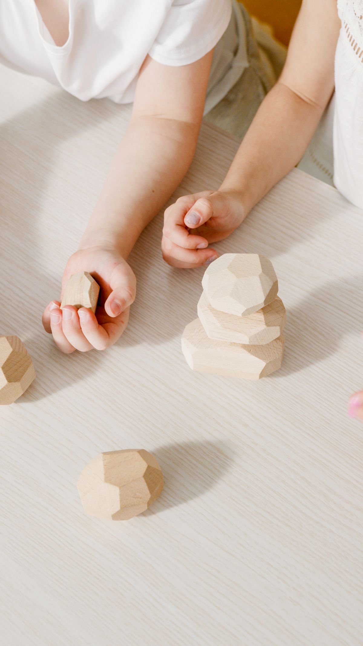 Child practicing scissor skills with occupational therapist guidance
